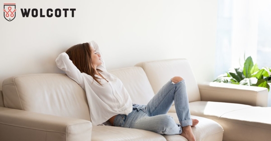Woman sitting in comfort on a couch